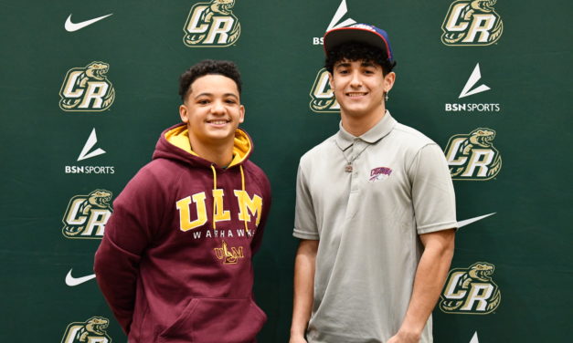 Two Copperheads football players sign to play in college