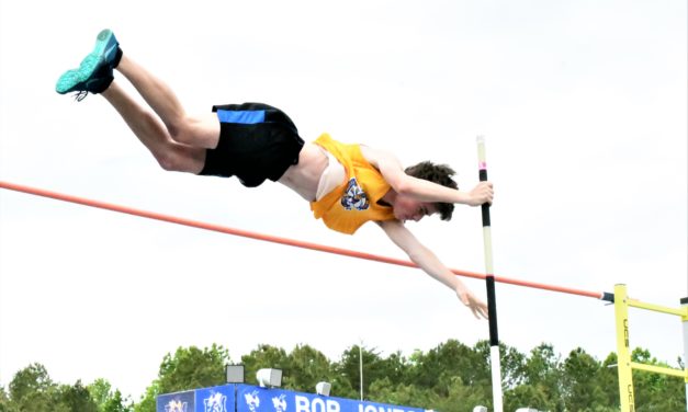Local teams split region track championships